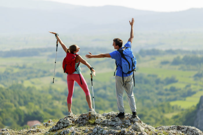 Young couple hiking on the mountain